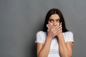 Dental Patient Shyly Hiding Her Missing Teeth