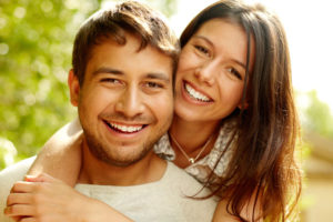 Dental Patients Smiling With Well Cared For Dental Implants In New London, CT