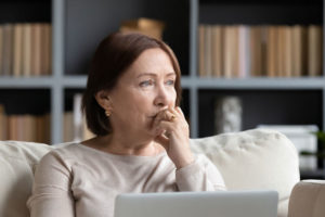 Dental Patient Wondering If She Should Get Dental Implants Or Dentures in New London, CT