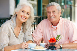 Dental Implant Patients Eating Together With Their False Teeth in New London, CT